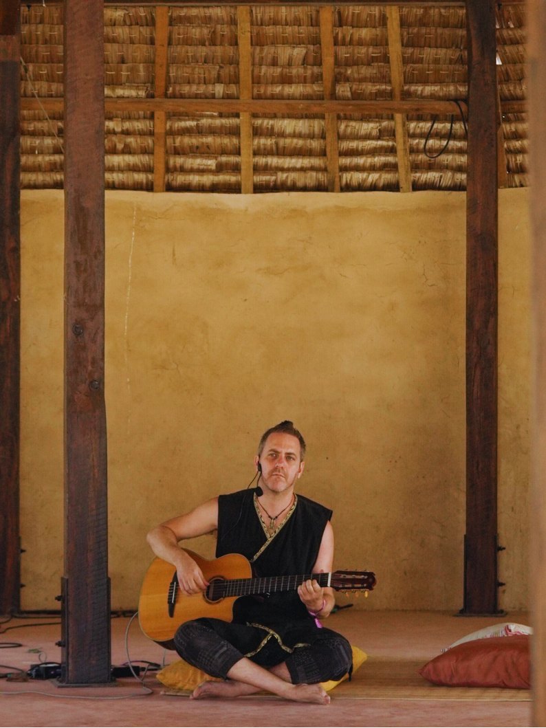 Nir playing guitar
